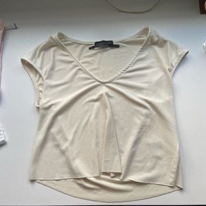 Raw hemmed, slightly cropped top